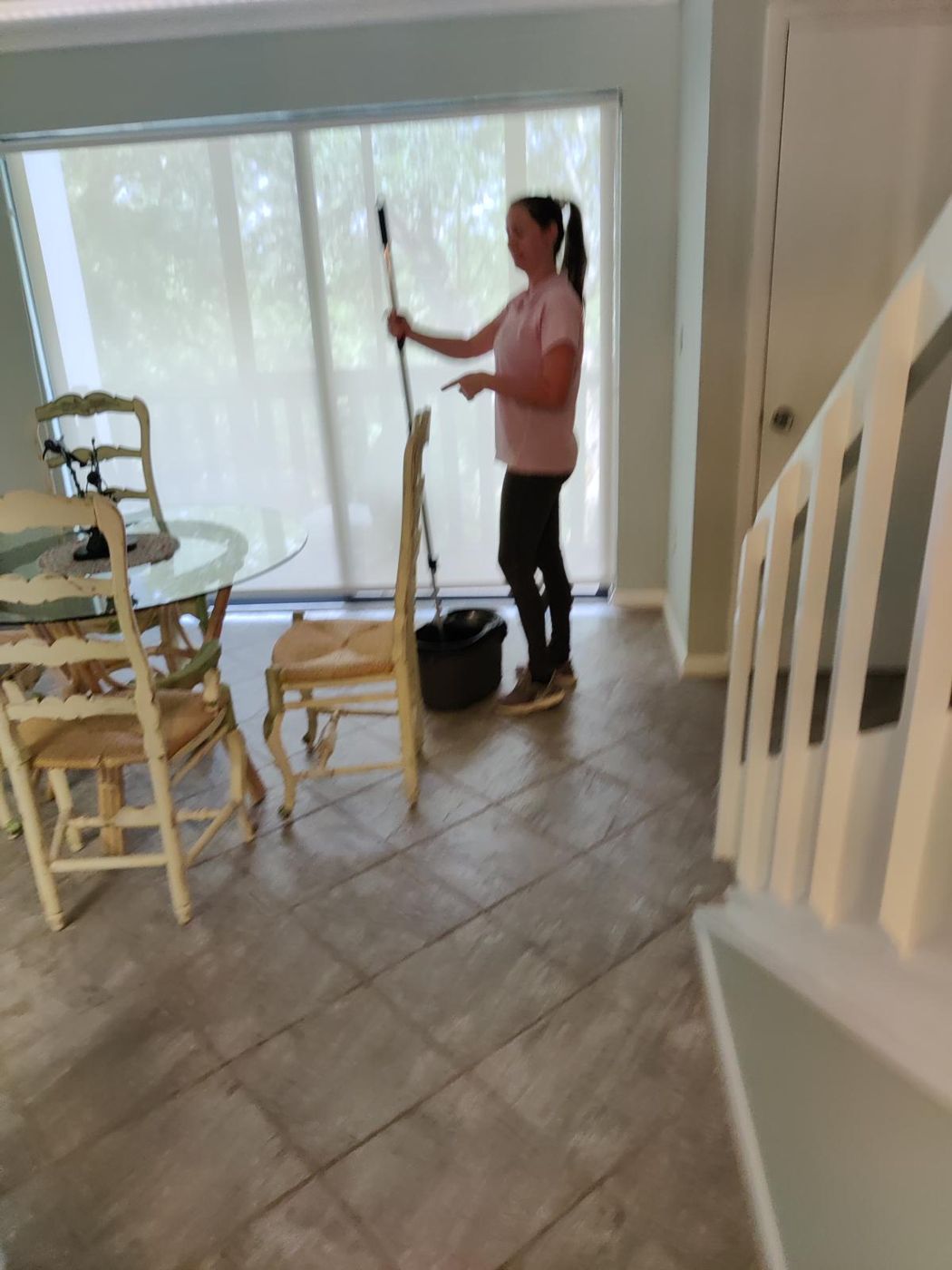 Team member mopping a dining area